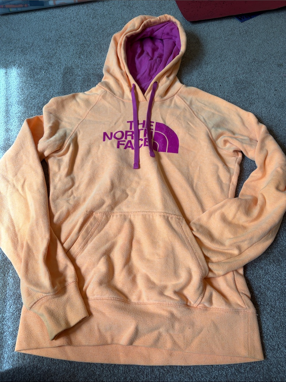 The North Face Peach Hoodie with Purple Logo and Lining